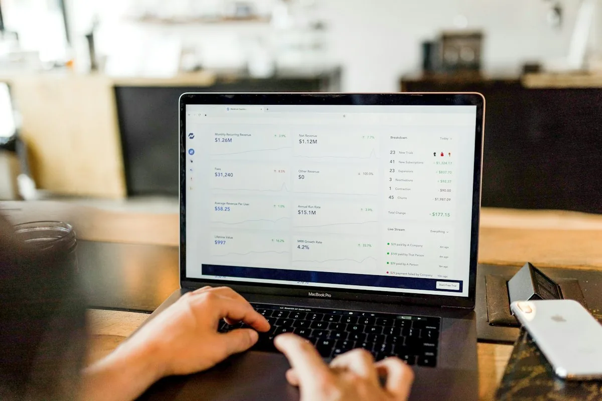 Person reviewing a revenue dashboard on a laptop