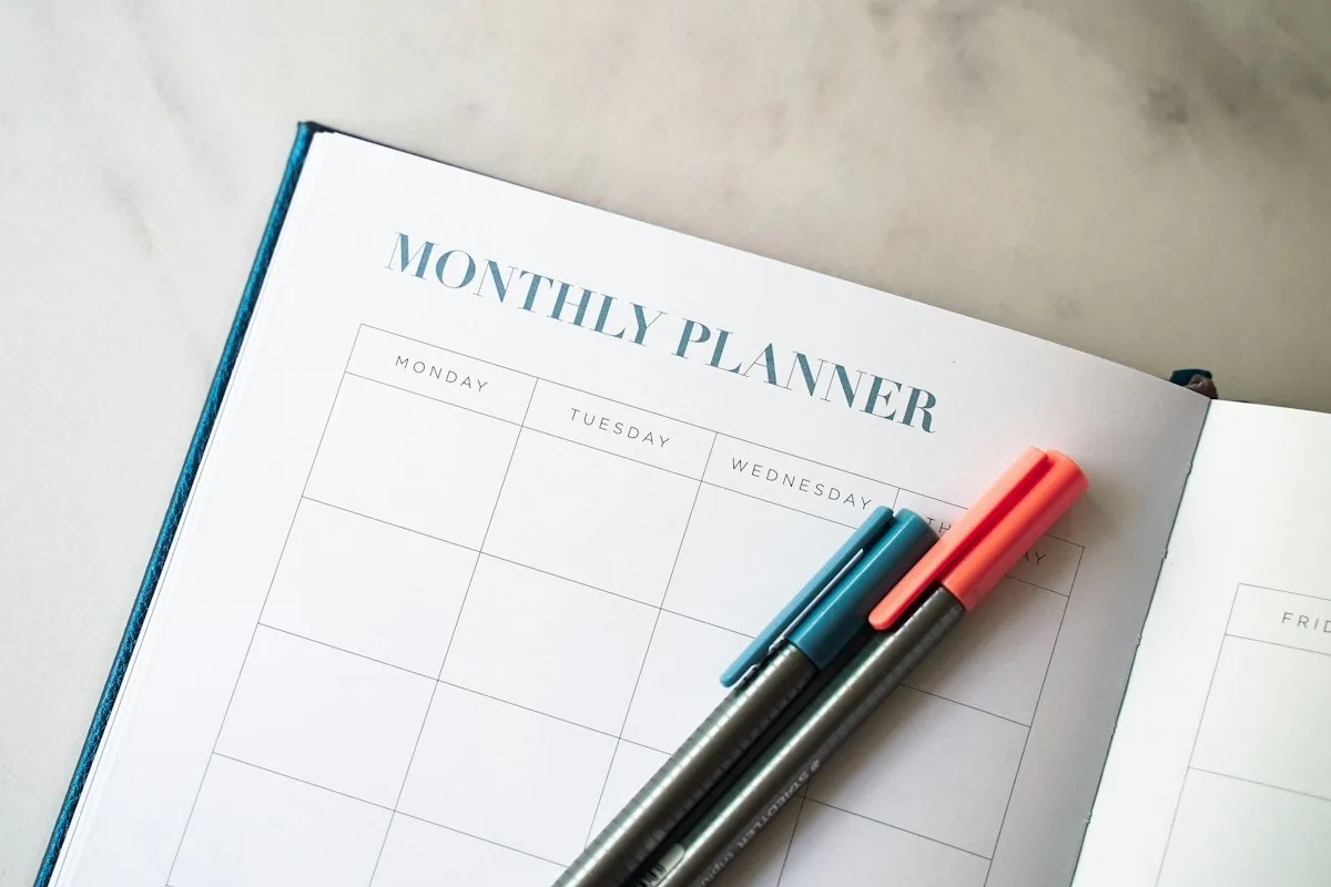 Monthly planner and pens for budgeting
