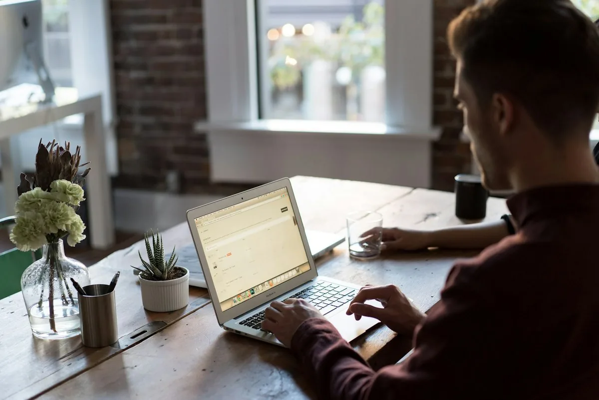 Business owner working on a laptop at a desk